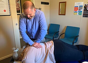 Dr Jon Powderly - CANBERRA SPINE CENTRE